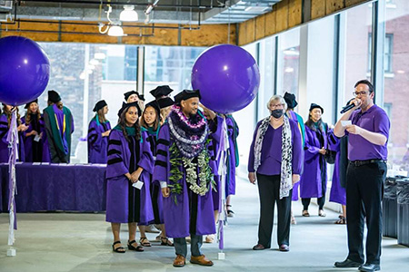 Paulo Sitagata (right) at his commencement ceremony for the Class of 2021 at Northwestern University
